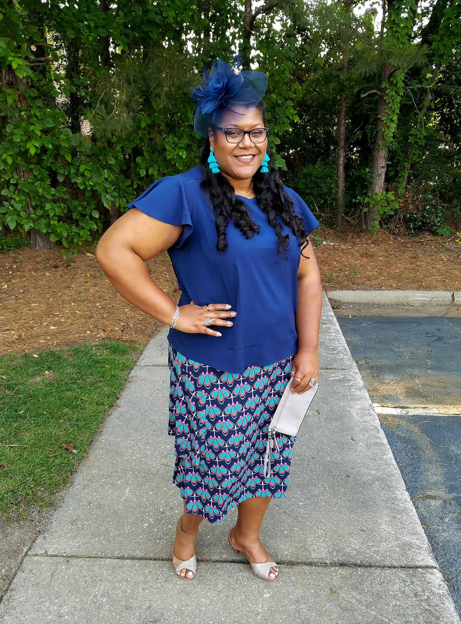 Blue print skirt and fascinator hat.