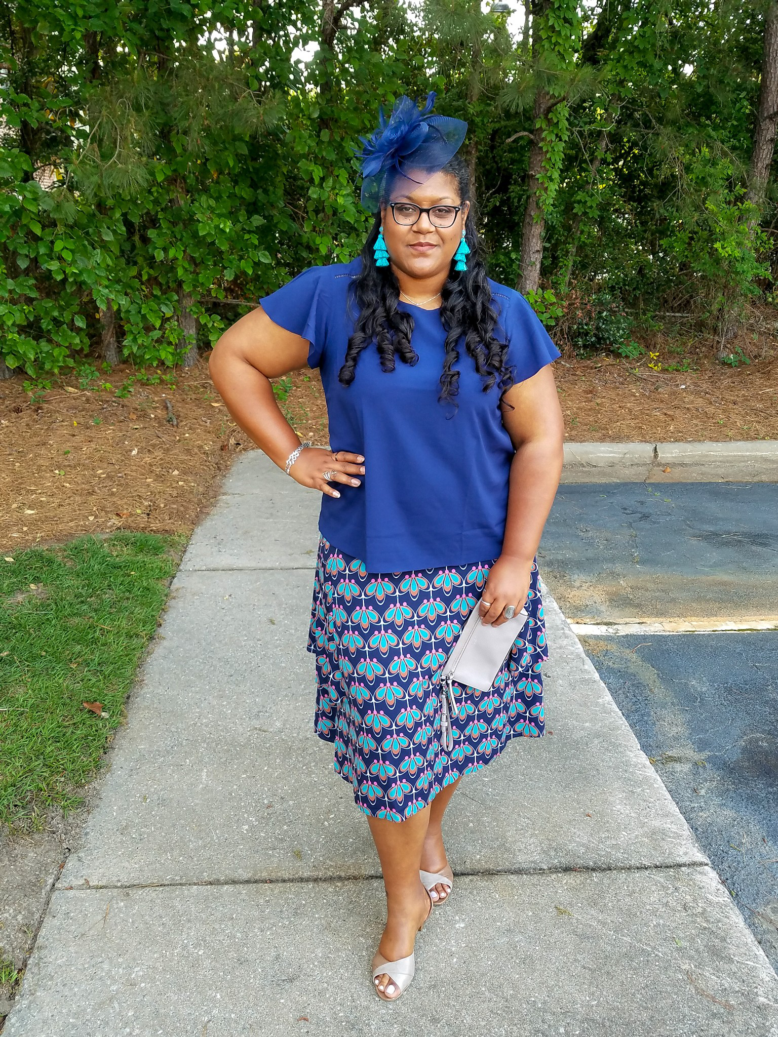 Blue print skirt and fascinator hat.