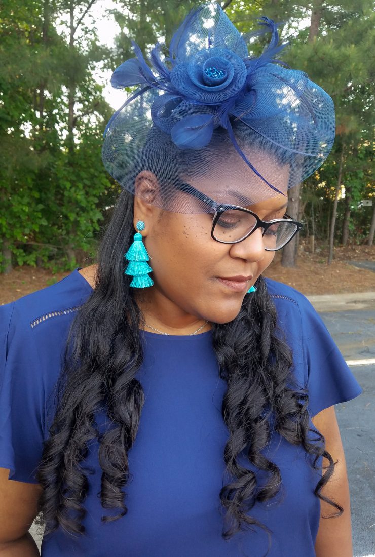 Blue print skirt and fascinator hat.